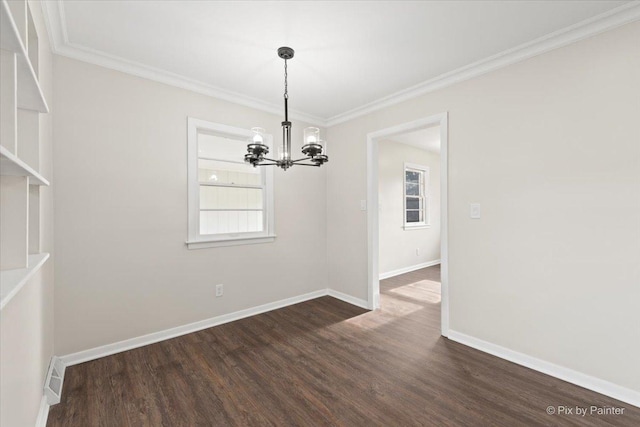 unfurnished dining area with ornamental molding, dark hardwood / wood-style flooring, and a notable chandelier