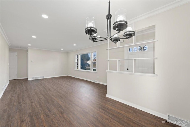 unfurnished living room with crown molding, dark wood-type flooring, and a notable chandelier