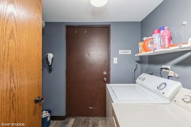 washroom with dark wood-style floors, laundry area, and washer and clothes dryer