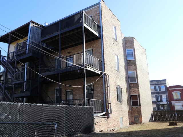 view of side of home with a balcony