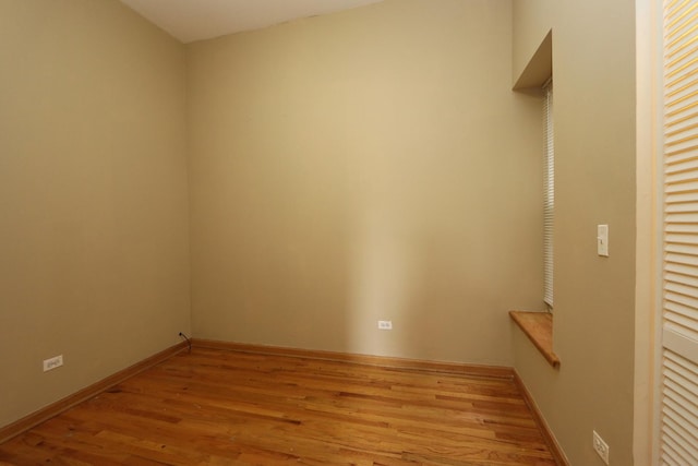 spare room with light hardwood / wood-style flooring