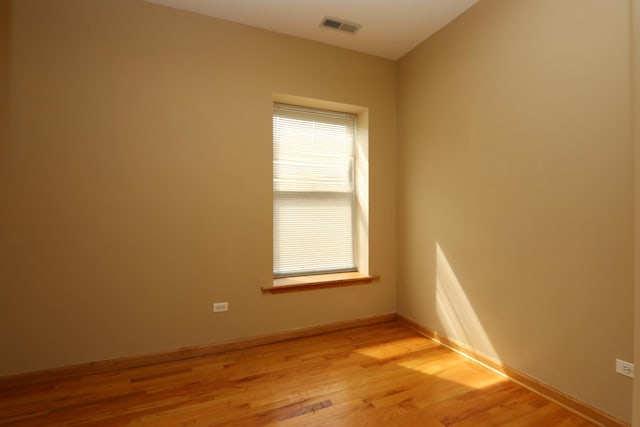 unfurnished room with light hardwood / wood-style floors