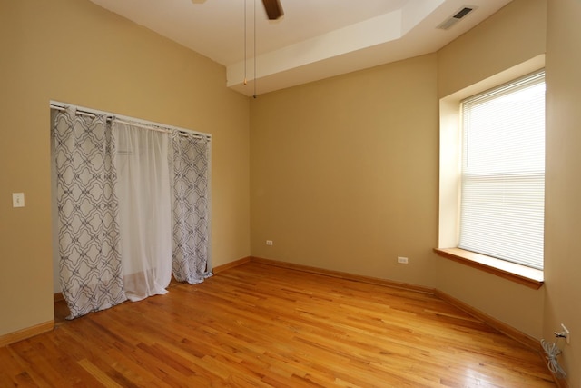 spare room featuring light wood-type flooring and ceiling fan