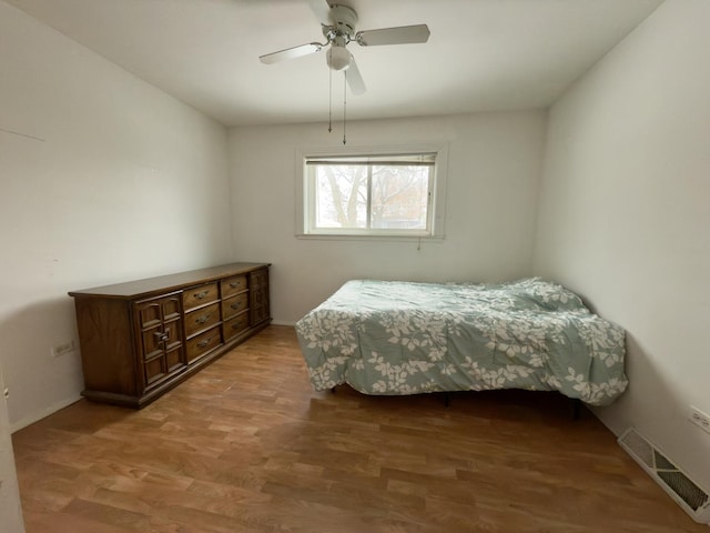 bedroom featuring hardwood / wood-style floors and ceiling fan