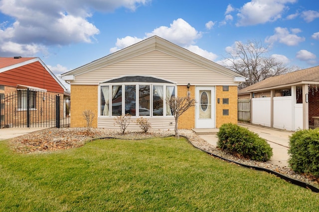 rear view of property with a yard