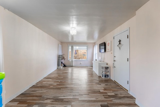 interior space with hardwood / wood-style flooring and an inviting chandelier