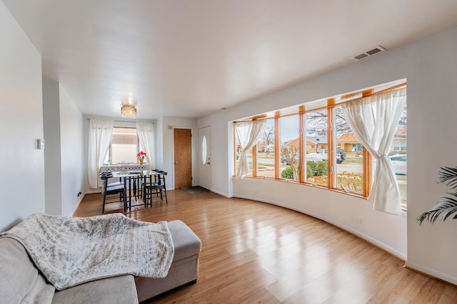 living room with light hardwood / wood-style floors