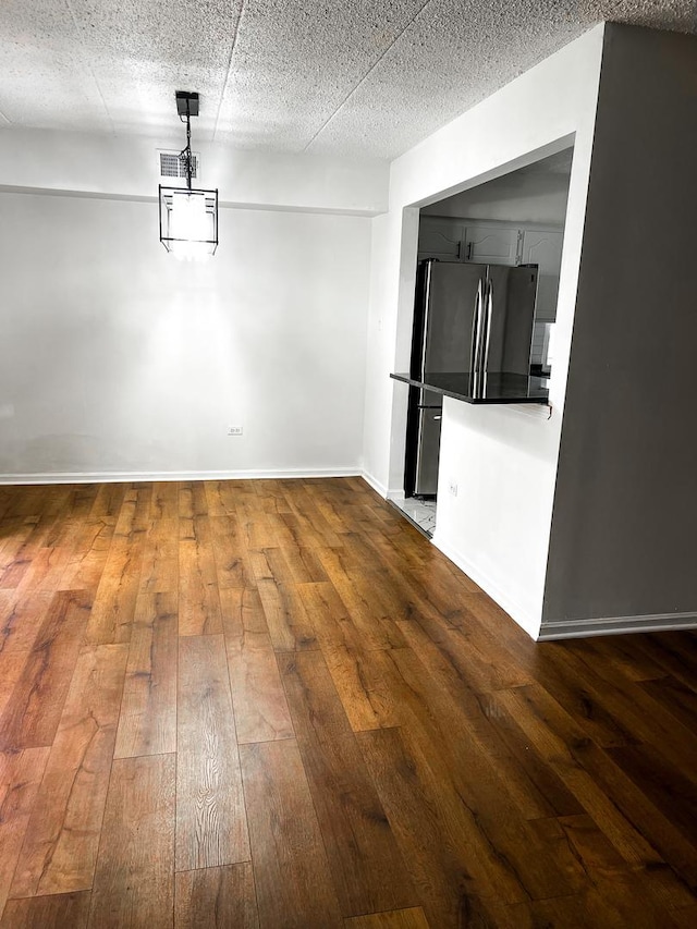 unfurnished dining area with hardwood / wood-style floors