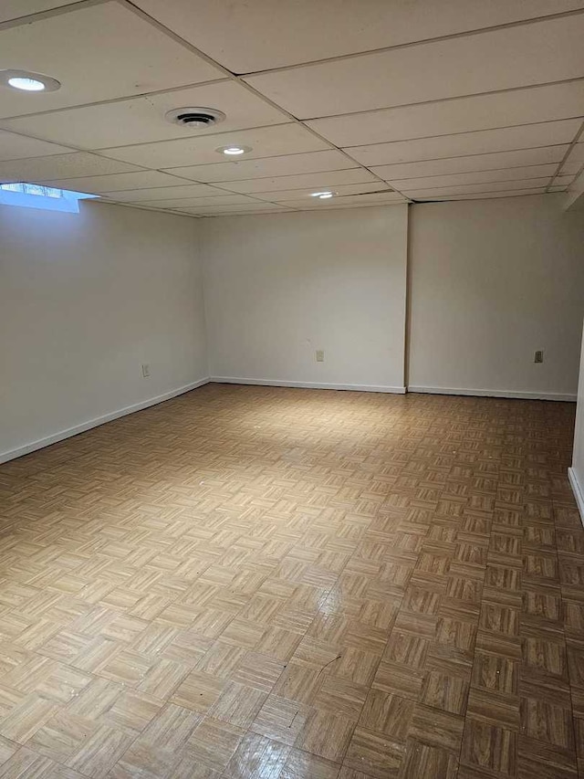 unfurnished room with a paneled ceiling