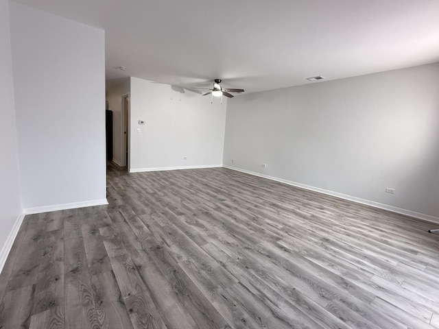 empty room featuring hardwood / wood-style floors and ceiling fan