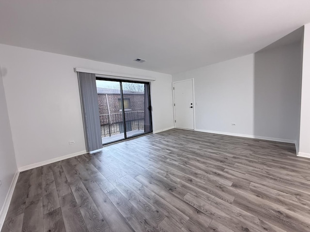 unfurnished room featuring hardwood / wood-style flooring