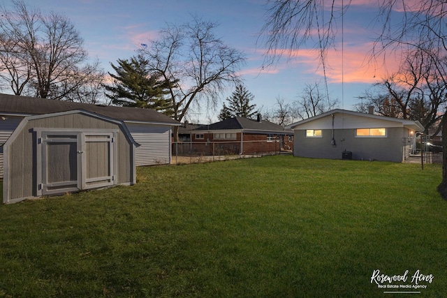 yard at dusk with a shed