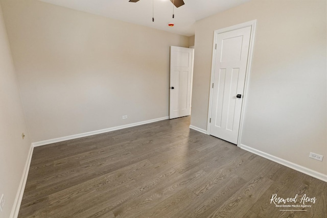 empty room featuring hardwood / wood-style flooring and ceiling fan