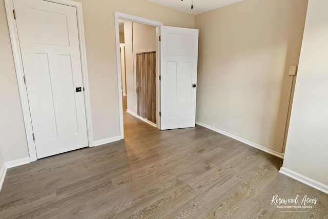 unfurnished bedroom featuring hardwood / wood-style floors