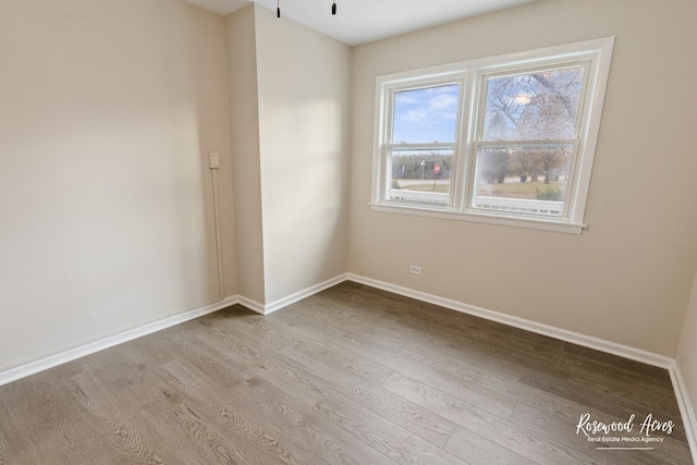 unfurnished room with light hardwood / wood-style floors