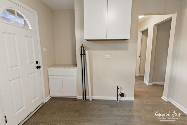 laundry room with hardwood / wood-style floors