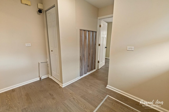 hall featuring wood-type flooring