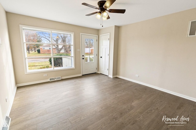 empty room with ceiling fan and wood-type flooring