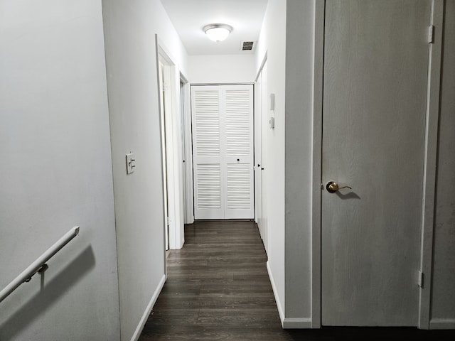 hall with dark hardwood / wood-style floors