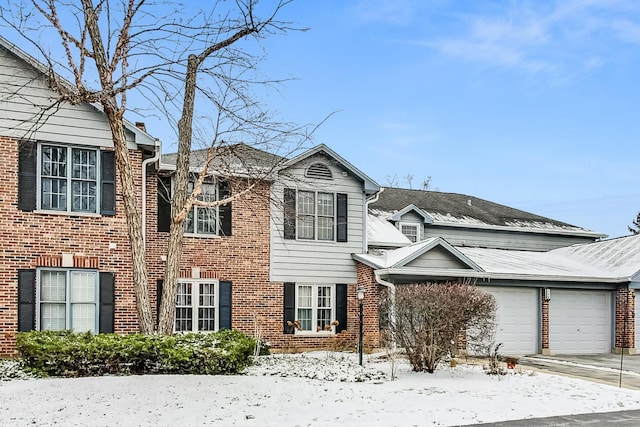 front of property with a garage