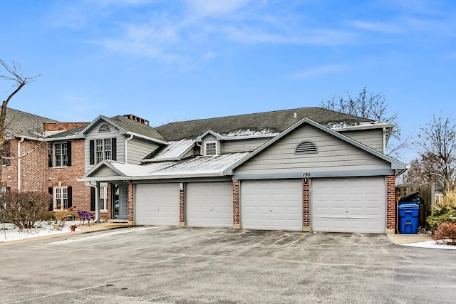 front facade with a garage