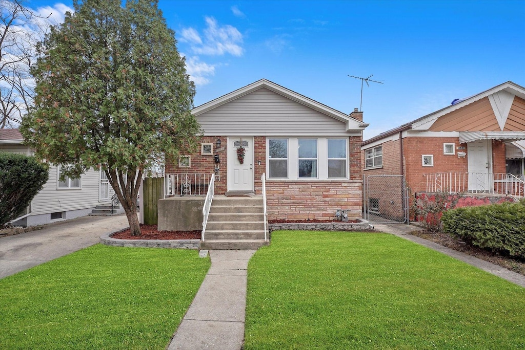 bungalow with a front lawn