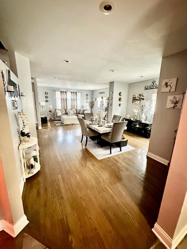 dining room with hardwood / wood-style flooring