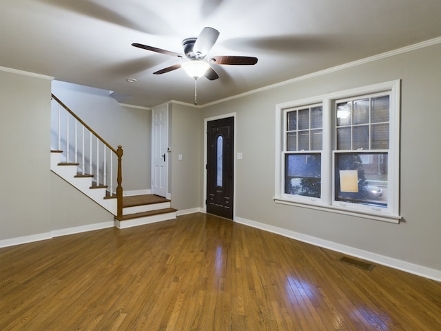 entrance foyer featuring hardwood / wood-style flooring, ceiling fan, and crown molding