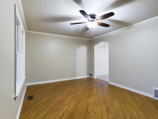 unfurnished room featuring hardwood / wood-style flooring, ceiling fan, and crown molding