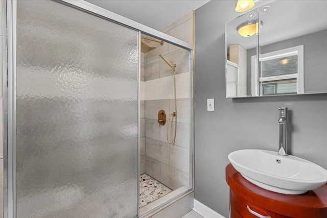 bathroom with vanity and an enclosed shower