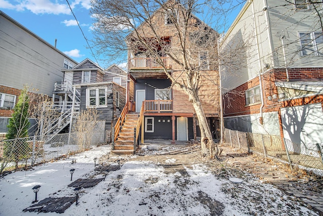 view of front of home featuring a balcony