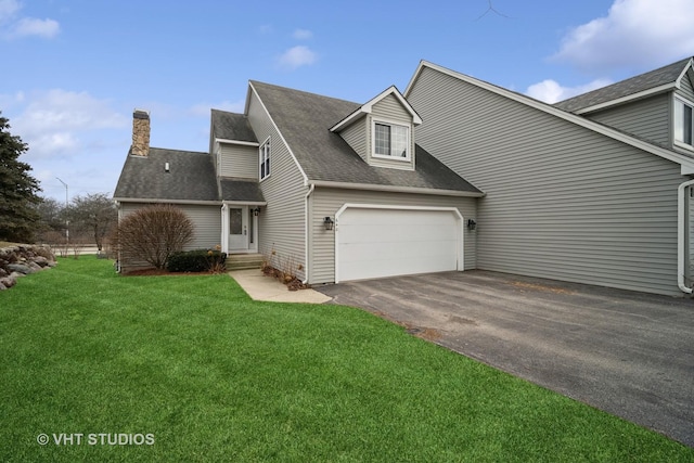 view of front facade featuring a garage and a front lawn