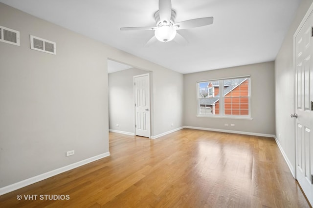 spare room featuring ceiling fan and light wood-type flooring