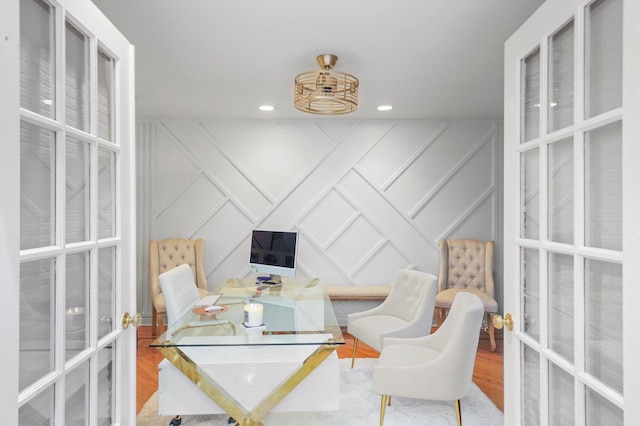 office area with hardwood / wood-style floors and french doors