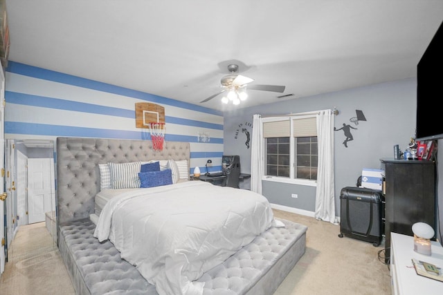 bedroom featuring ceiling fan and light carpet