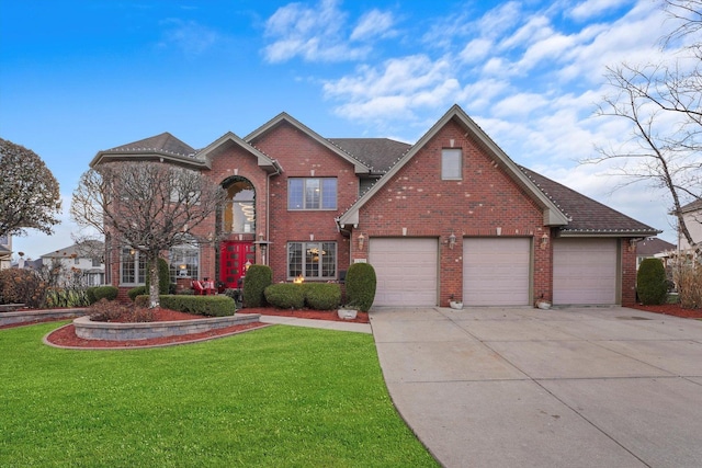 view of front property featuring a garage and a front yard