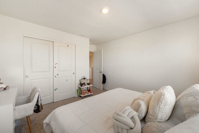 carpeted bedroom featuring a closet