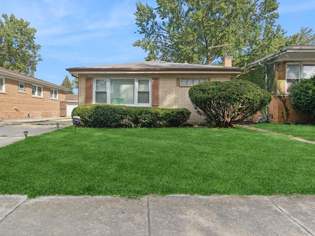 view of side of home featuring a yard