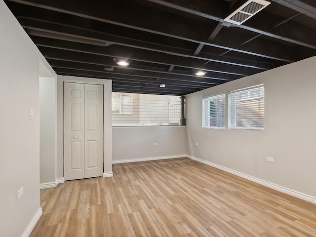 basement featuring light hardwood / wood-style flooring