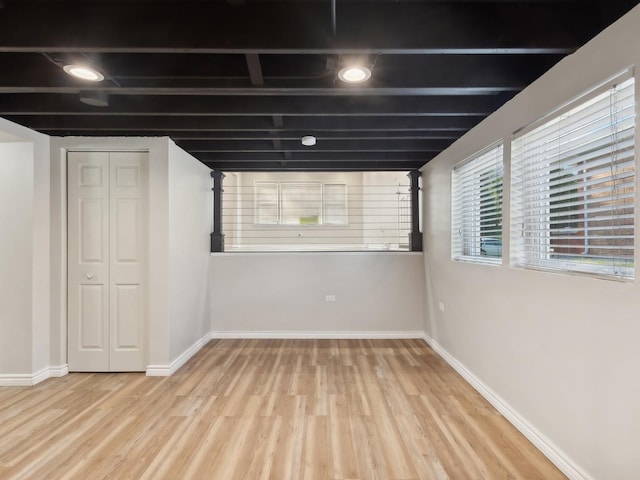 basement featuring light wood-type flooring