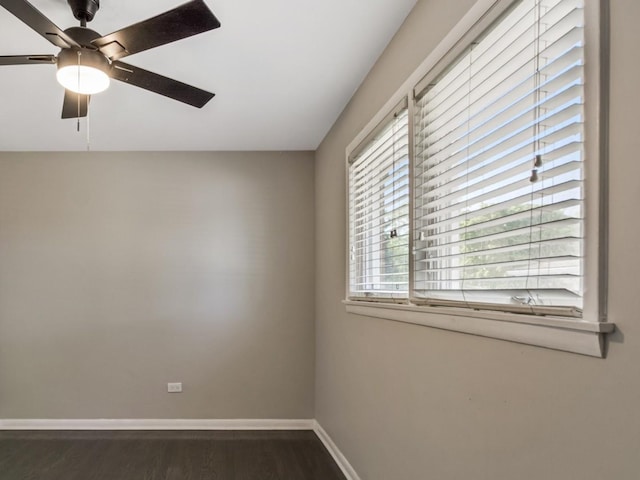 empty room featuring dark hardwood / wood-style floors and ceiling fan