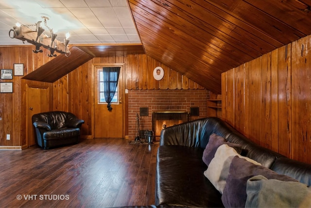 unfurnished living room with wooden walls, wooden ceiling, wood finished floors, an inviting chandelier, and vaulted ceiling