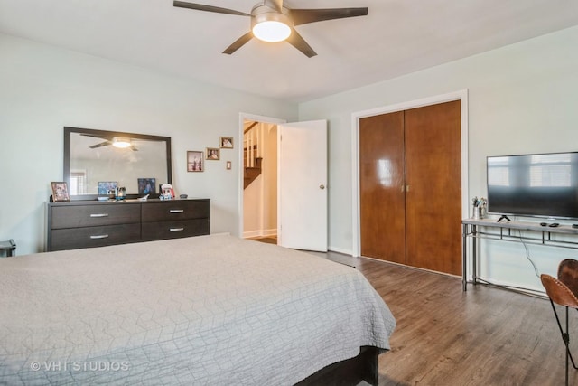 bedroom featuring wood finished floors and a ceiling fan