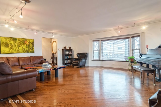 living room featuring wood finished floors and baseboards