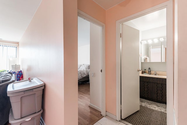 bathroom with hardwood / wood-style floors, vanity, and toilet