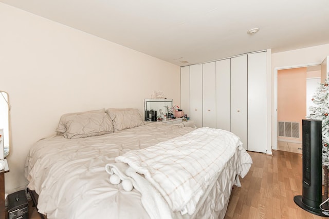 bedroom featuring a closet and hardwood / wood-style floors