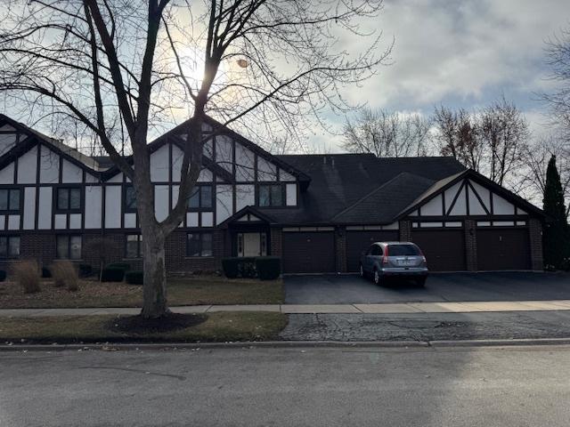 tudor house with a garage