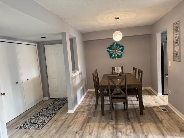 dining room with hardwood / wood-style floors