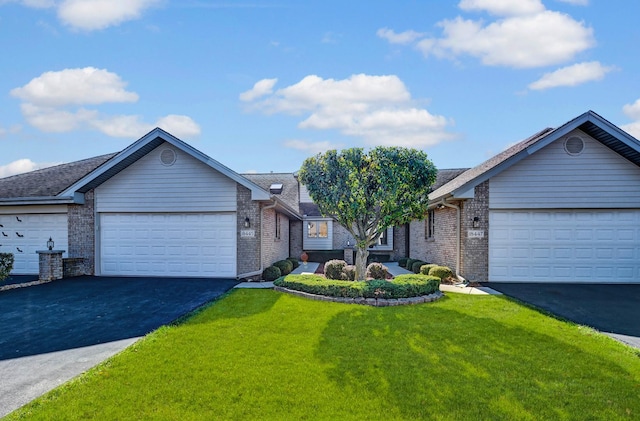 single story home with a garage and a front lawn