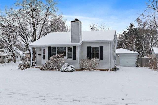 view of front of home featuring an outdoor structure and a garage